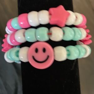 Bracelet set of three, hot pink and blue themed.